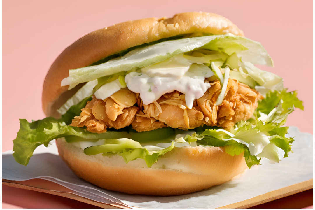 10 - Chicken placed inside a soft bun with a dollop of mayonnaise