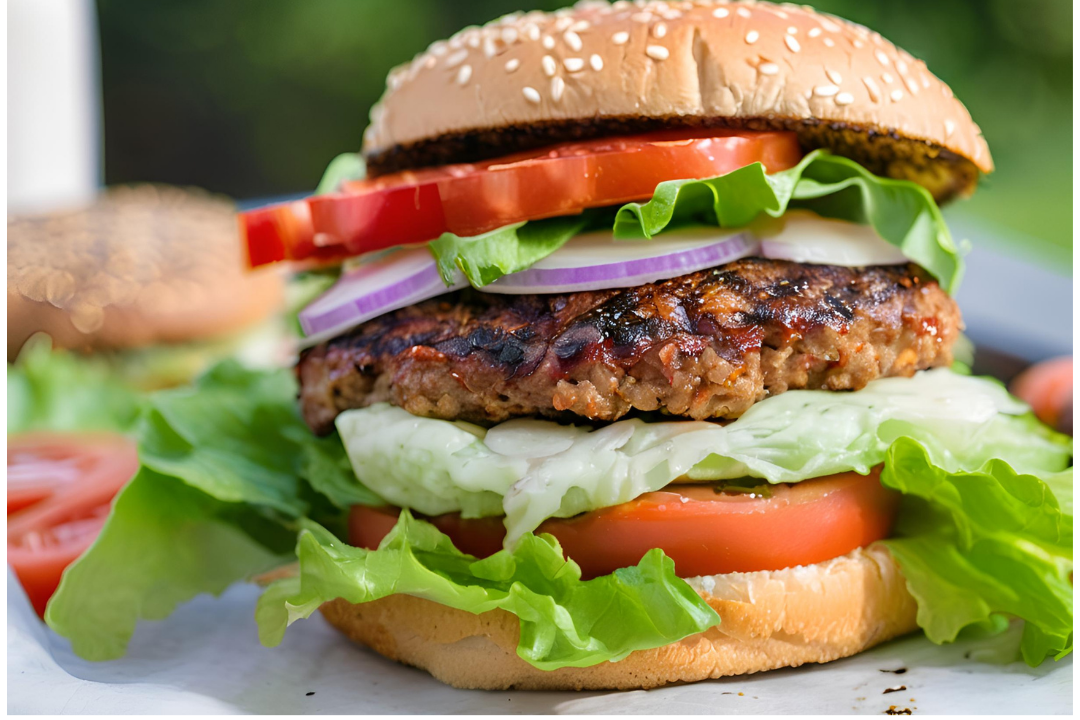 14 - The burger assembled with mayonnaise and ketchup in a sesame seed bun